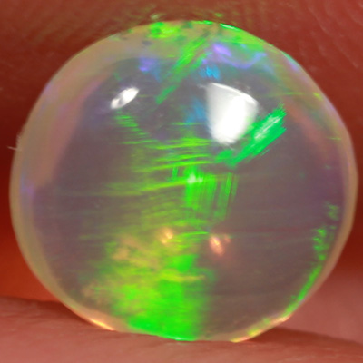 SOLID CRYSTAL OPAL Linear Rolling flashes of green fire